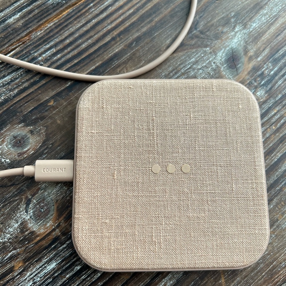 Brand new never been used.   Courant wireless charger.  Sleek and functional